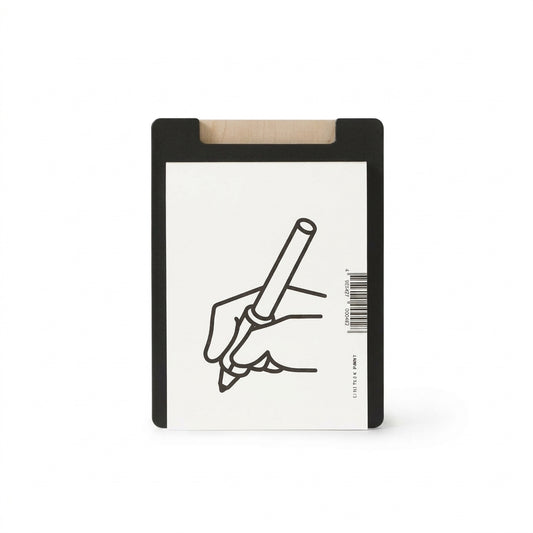 Al Memo Board with black frame, natural wood clip, and line-art hand-holding-pen illustration on white surface