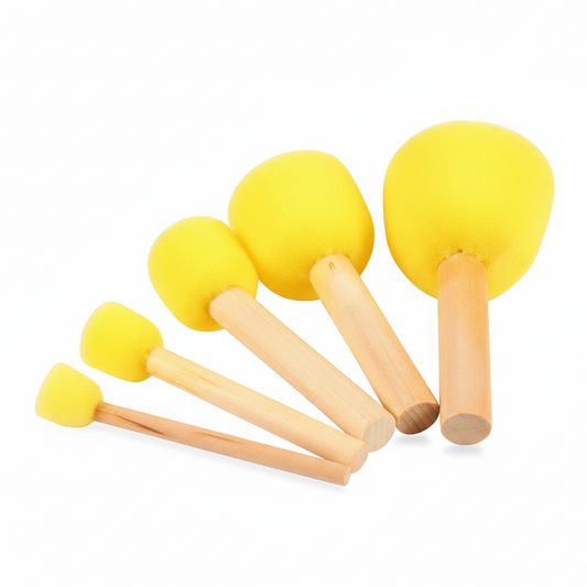 Five foam brushes in graduated sizes with yellow foam heads and natural wooden handles arranged in ascending order on white background
