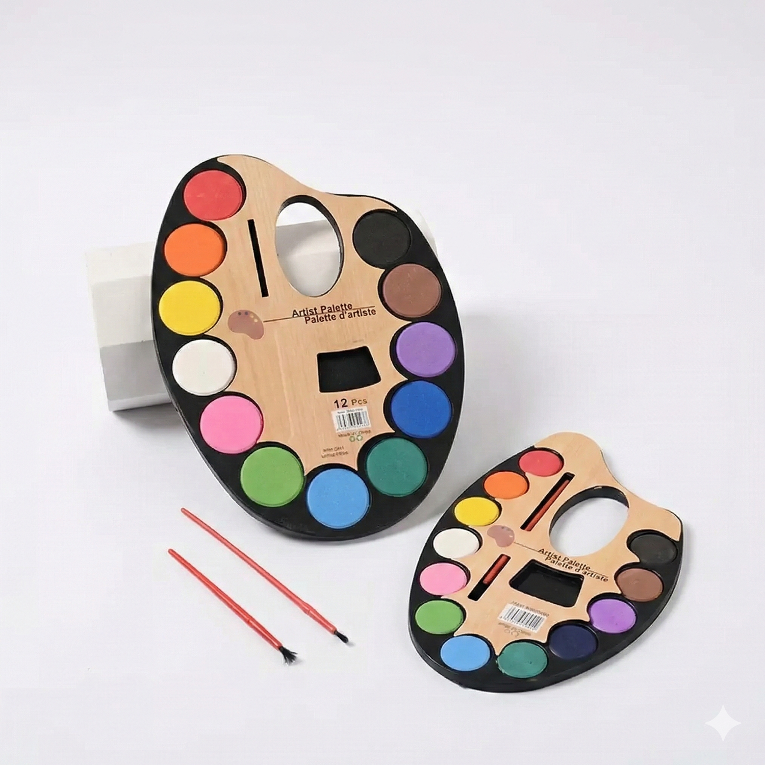 Artist Palette With Brushes set showing large and small wooden oval palettes with 12 colors and 2 red paintbrushes on white background