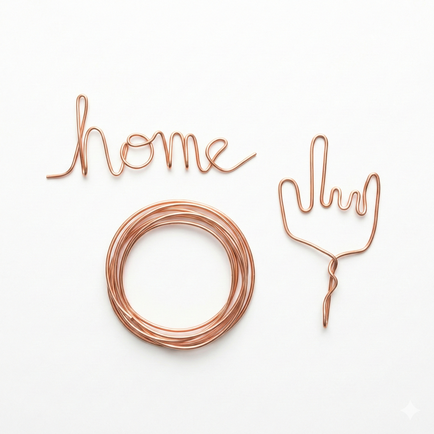 Copper art wire set featuring 'home' text, decorative fork design, and coiled circular wire on white background