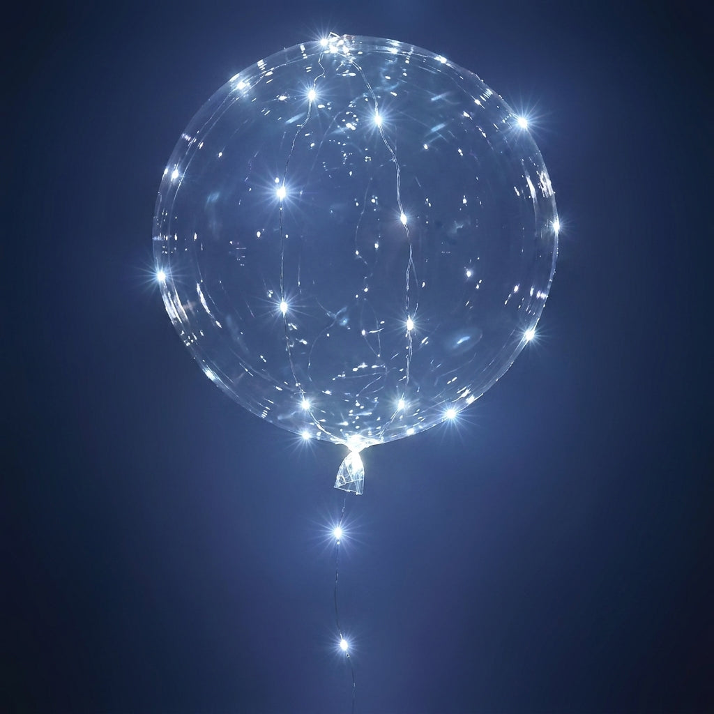 Clear LED light-up balloon with white fairy lights glowing inside against a dark blue background