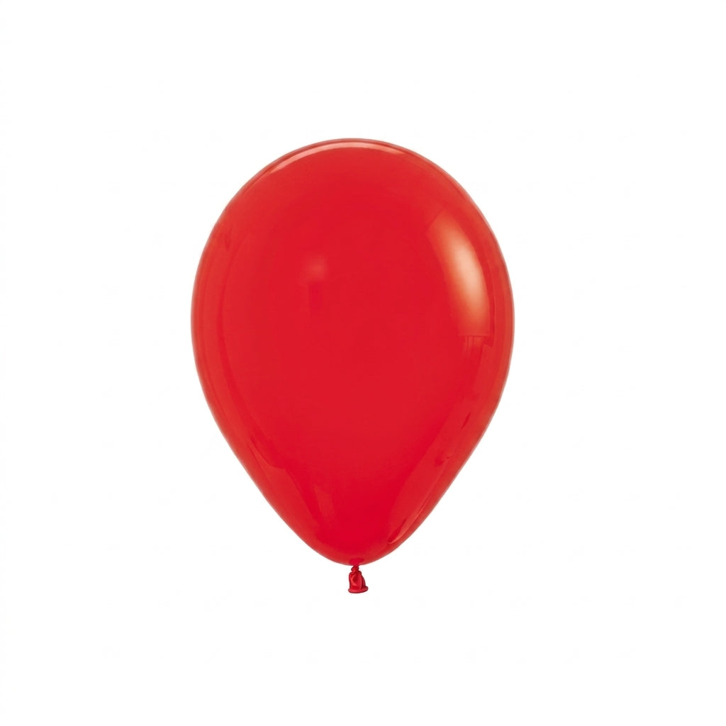 Single red latex balloon with teardrop shape on white background