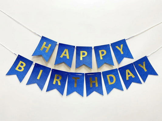 Happy Birthday banner with 13 blue pennant flags featuring gold foil letters strung on white cord
