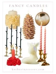 Fancy Candles collection with cream pillar candles, pinecone shape, gold sphere, pink twisted tapers, and red accent candles