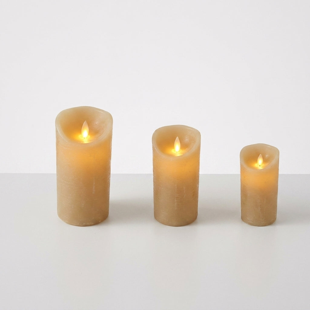 Set of 3 cream-colored LED flameless candles with flickering yellow flames, graduated sizes.