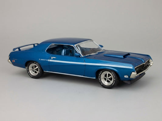 Blue 1969 Ford Mustang Eliminator die-cast model car with white stripes and detailed wheels