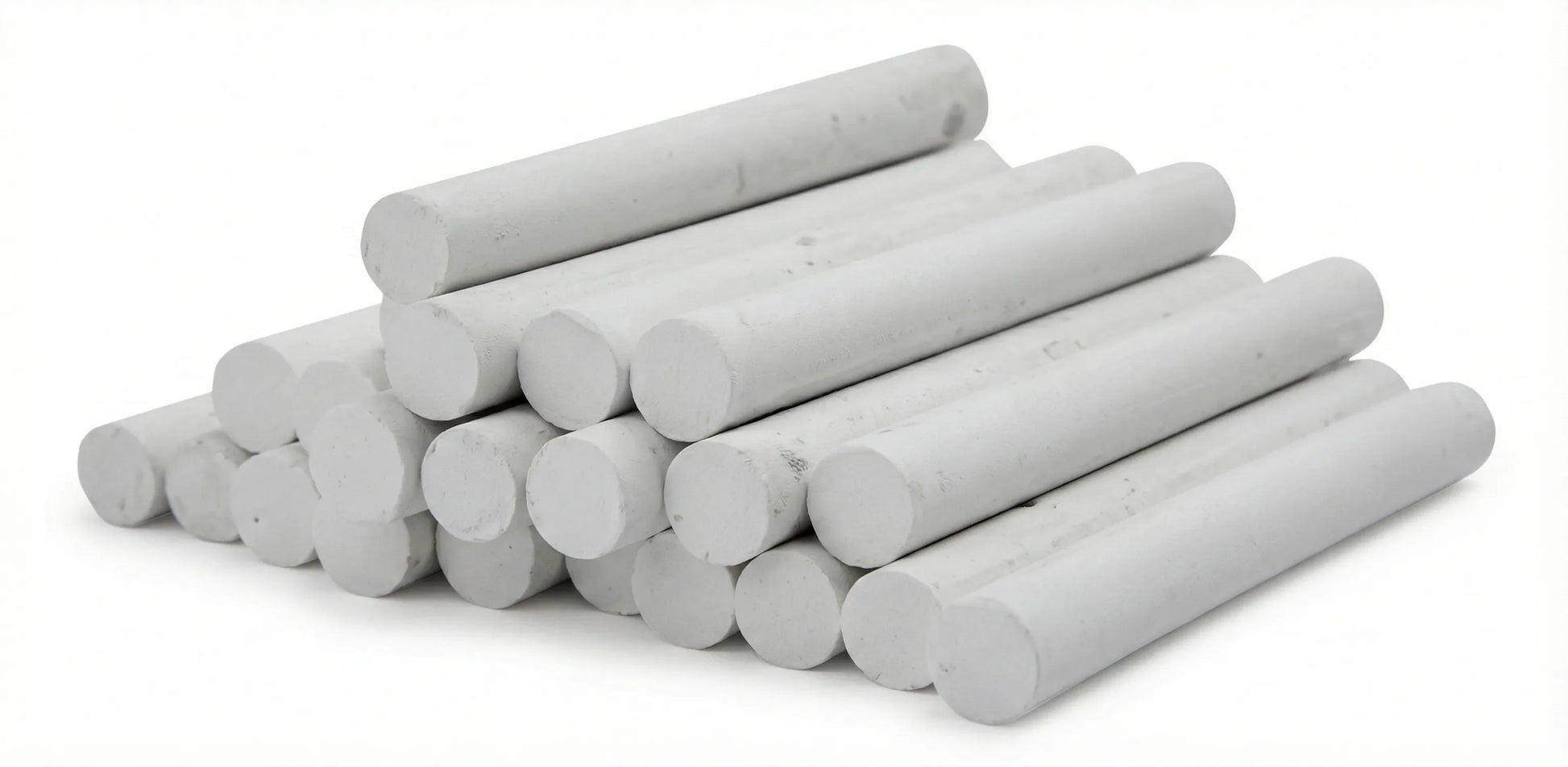 Chalk White cylindrical sticks - 24-piece set of white chalk in various sizes arranged in neat rows on white background