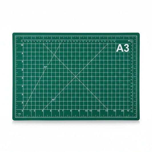 A3 green self-healing cutting mat with grid pattern, ruler markings, diagonal lines, and angle guides for precision cutting projects