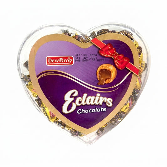 Dew Drop Eclairs Chocolate heart-shaped box with purple and gold packaging and red ribbon bow