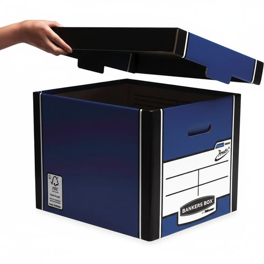 Bankers Box File Box 710 in navy blue and black with removable lid, shown open with hand removing the top lid, featuring label panel and carry handles
