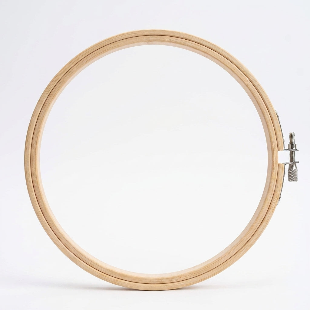 Natural wood 10-inch embroidery hoop with metal screw clasp on white background