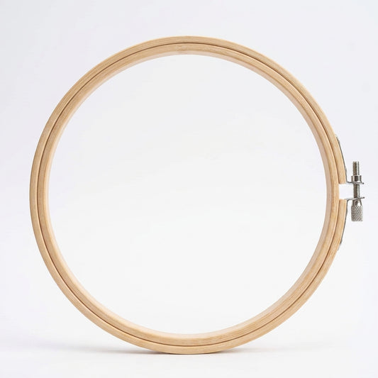 Natural wood 10-inch embroidery hoop with metal screw clasp on white background