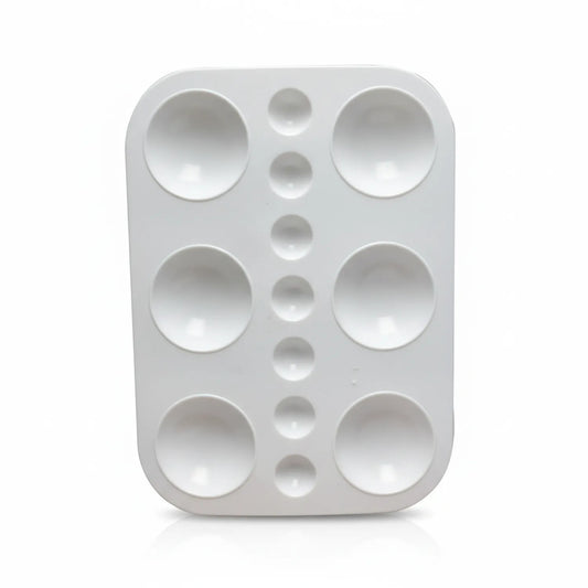 White ceramic Mixing Palette M with 6 large circular wells and 9 smaller wells arranged vertically down the center for artist paint mixing.