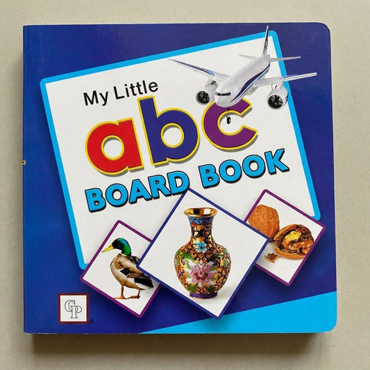 My Little ABC Board Book with colorful letters, airplane, duck, vase, and walnut illustrations on blue cover