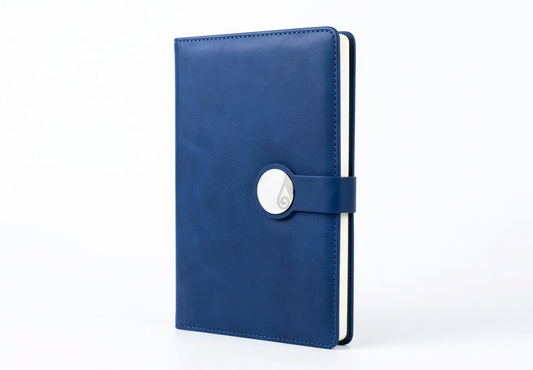 Blue leather A5 notebook with snap button closure and cream-colored pages