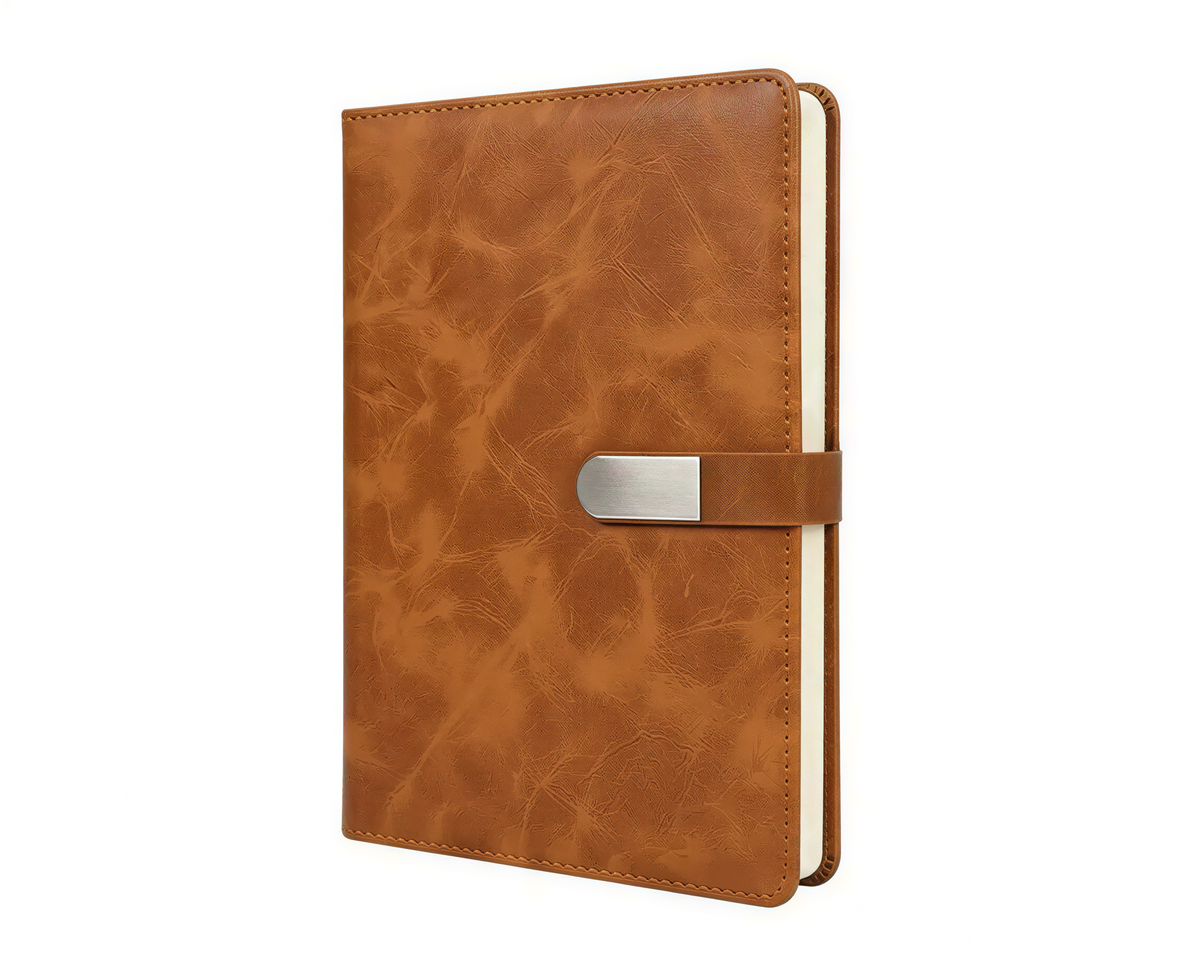 Brown leather A5 notebook with metallic arrow lock clasp and cream-colored pages, shown closed at angle.