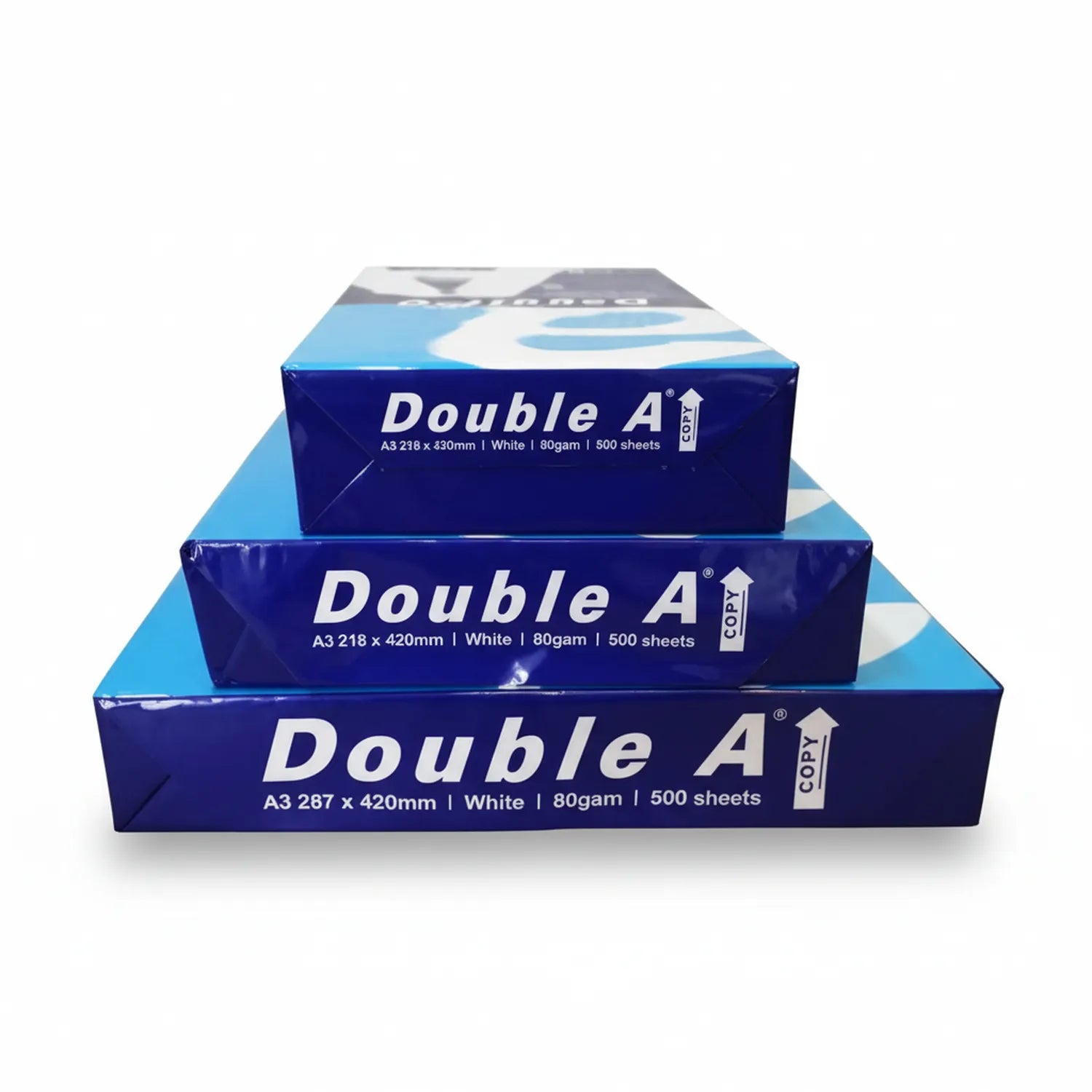 Three stacked reams of Double A brand A3 copy paper in navy blue packaging, showing 500 sheets per ream at 80gsm weight.
