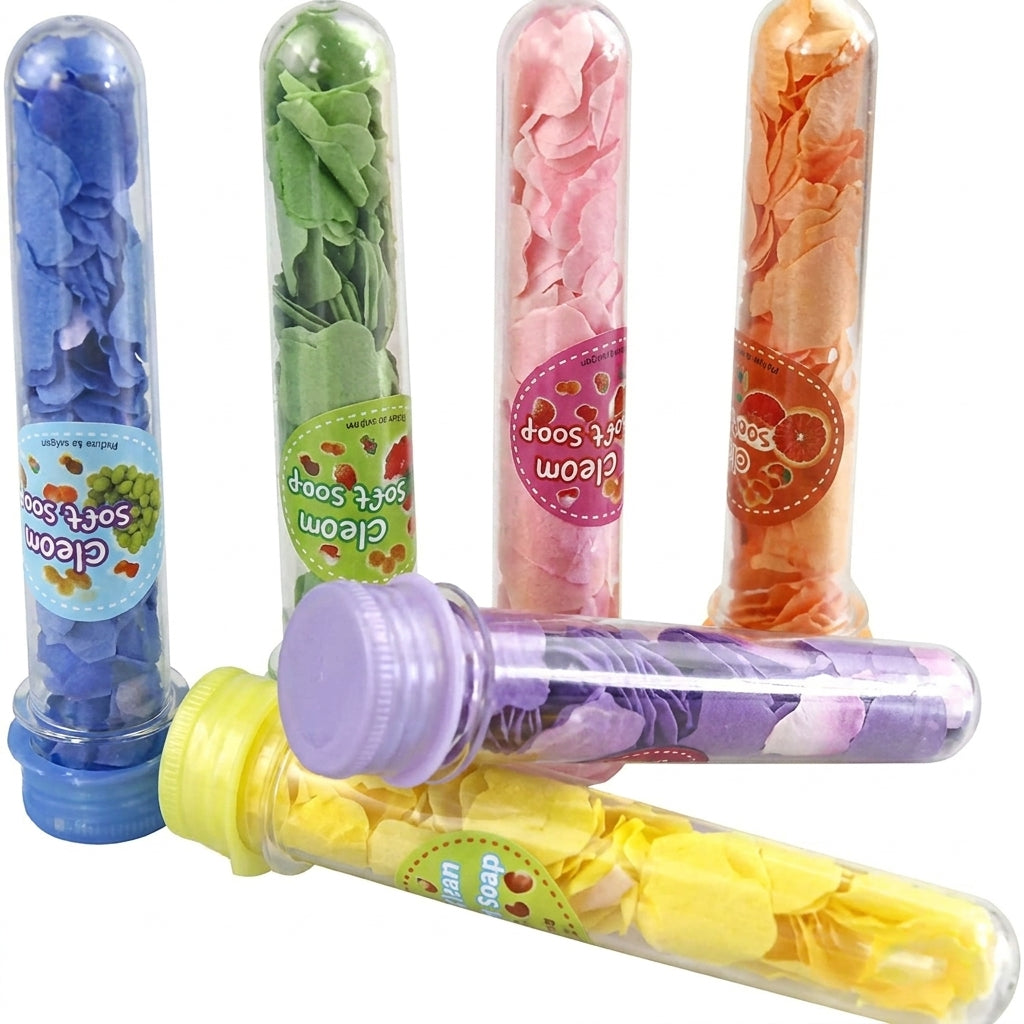 Six colorful paper soap tubes in blue, green, pink, orange, yellow, and purple with screw-on caps and fruit labels.