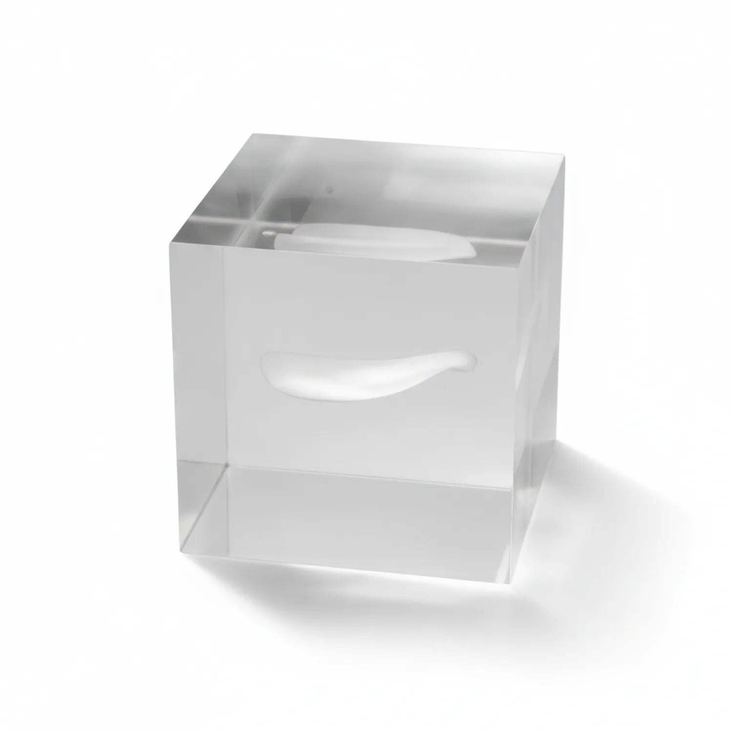 Clear acrylic paper weight with integrated tissue holder and compartments on white background