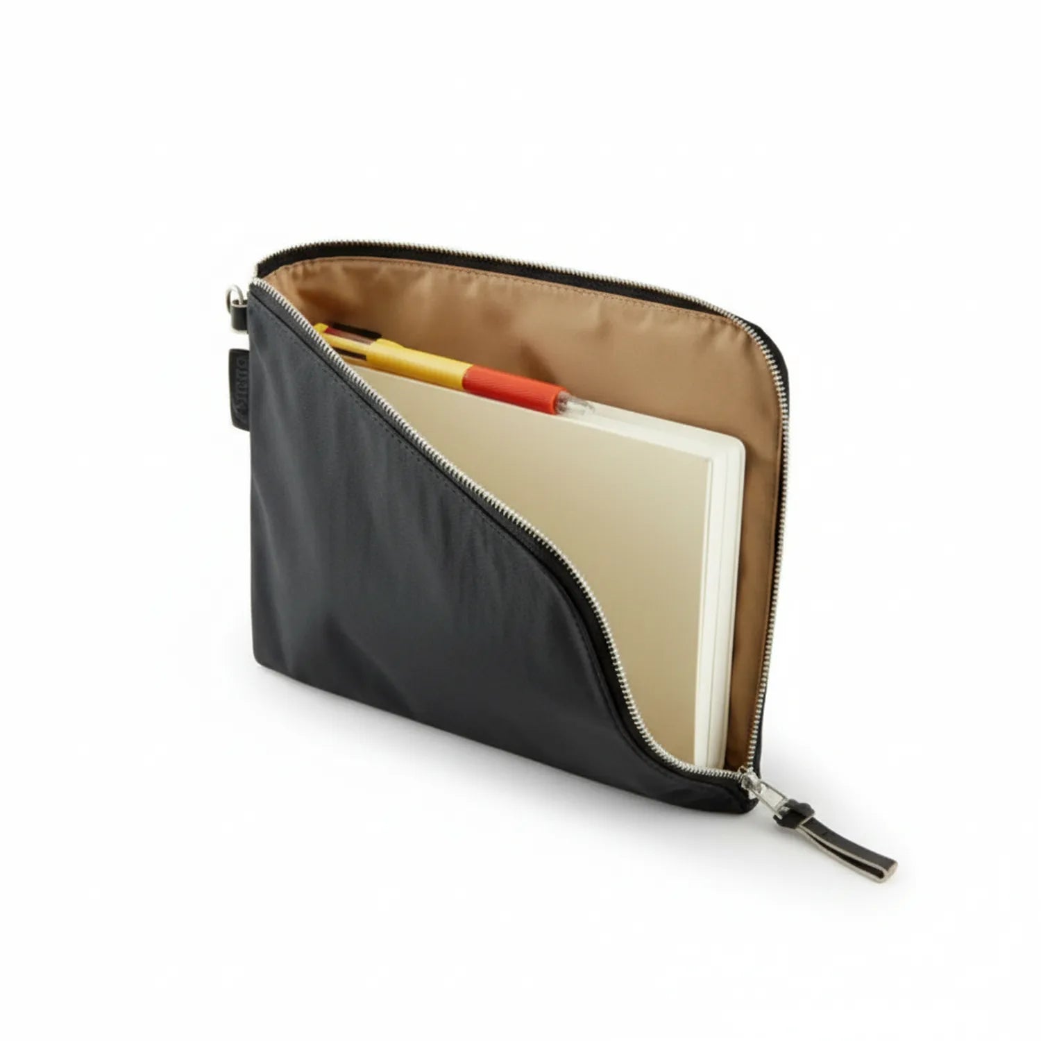 Black quilted A5 pouch with tan interior, opened to show notebook and pens inside, metal zipper closure visible