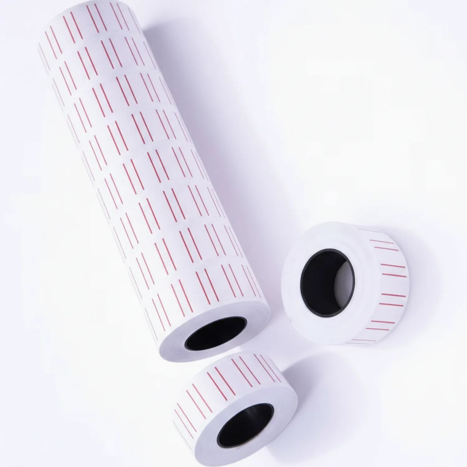 Price Roll labeling tape 3-pack consisting of one large roll and two standard rolls with red pricing marks and measurement grid on white background
