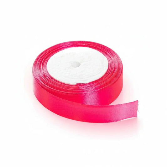 Hot pink satin ribbon 1 inch wide on white plastic spool, showing smooth lustrous finish and partial unraveled ribbon
