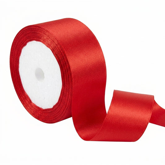 Red satin ribbon 2 inches wide on white spool with ribbon unfurled