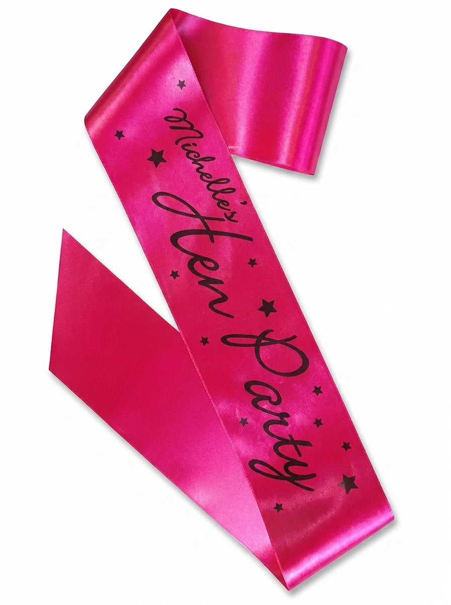 Bright hot pink satin sash with black script text and star designs, large party size