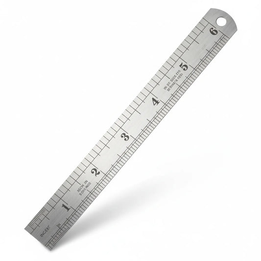 Silver metal 6 inch ruler with dual inch and metric scale markings, hole at top for hanging, precision measuring instrument