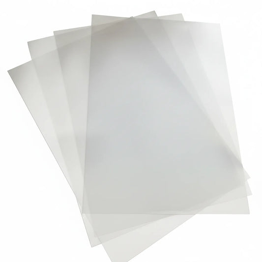 Multiple clear transparent plastic sheets fanned out, showing individual single sheets of professional-grade plastic material for art and craft use.