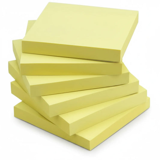 Stack of yellow 3x3 sticky notes with self-adhesive backing, showing multiple pads arranged in a pile on white background
