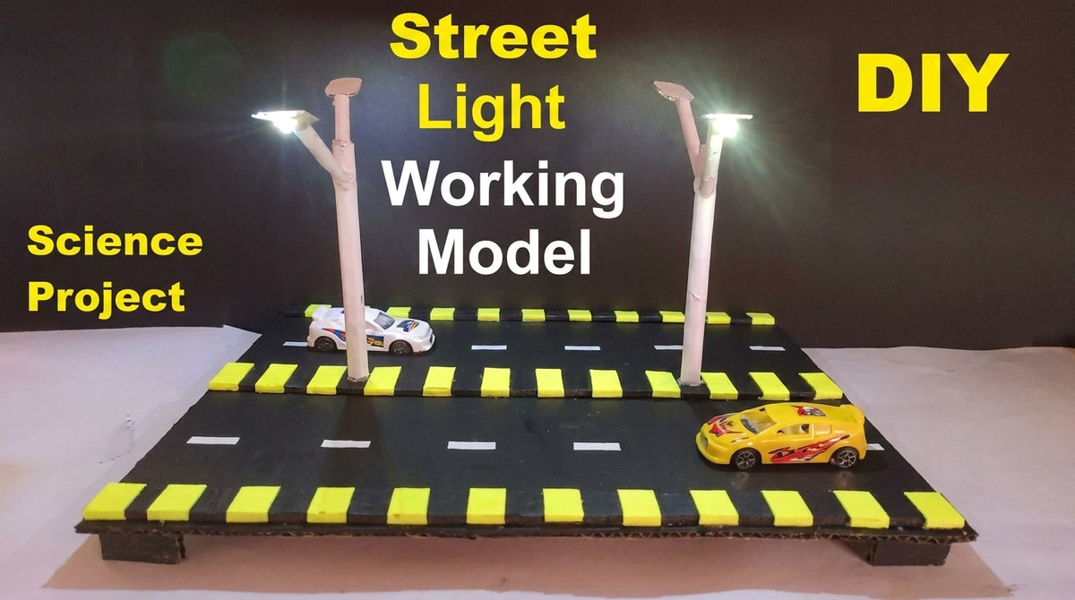 Street Light Working Model with two LED poles on black diorama base with yellow crosswalk markings and toy cars