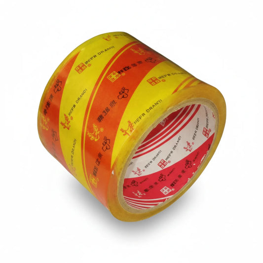 Eagle Brand Scotch Tape 3 Inch roll with yellow and orange packaging, showing clear adhesive tape core and branded dispenser box