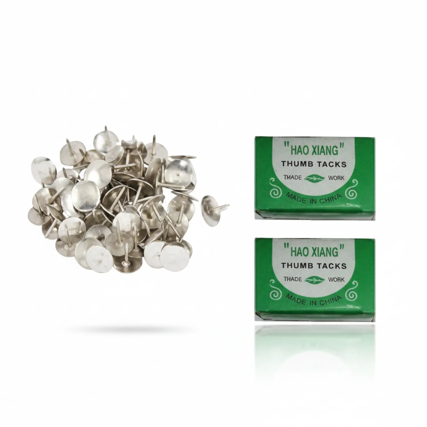 Hao Xiang Thumb Tacks product display showing loose silver metal push pins on left and two green packaging boxes on right