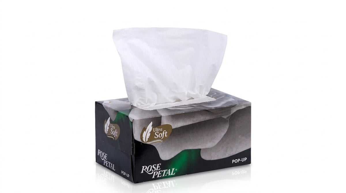 Rose Petal Ultra Soft Pop-Up tissue box with black and gray packaging, white tissues visible in dispenser opening